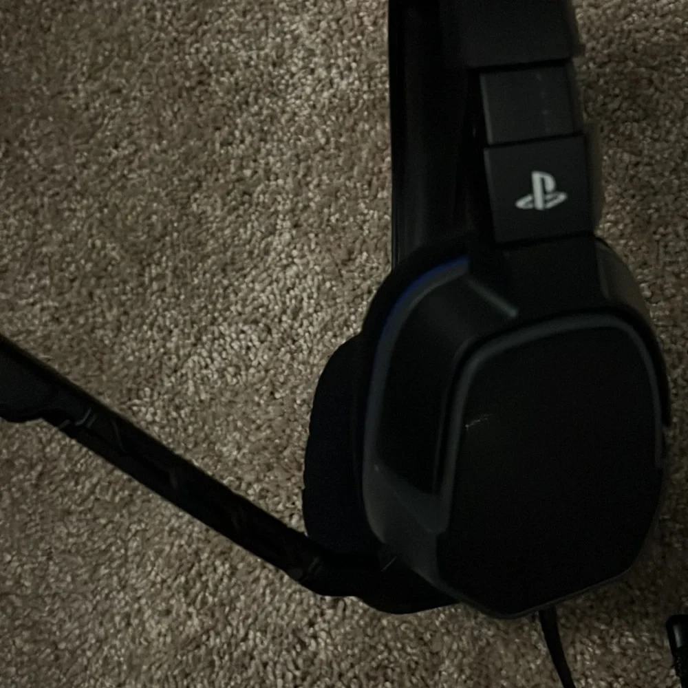 Slightly used PlayStation headset with microphone. With audio adjuster on wire.